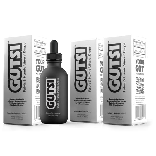 A bottle of GUTSI liquid and brewing mineral drops with its white and gray packaging boxes, displayed on a clean white background.